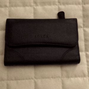 Soft leather wallet with outside change pocket.